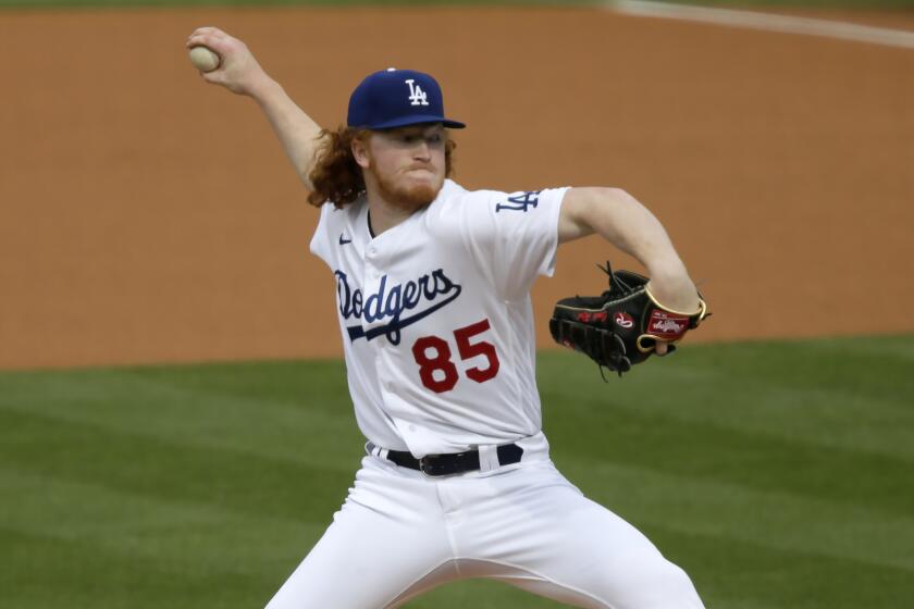 Los Angeles Dodgers starting pitcher Dustin May throws to a San Diego Padres.