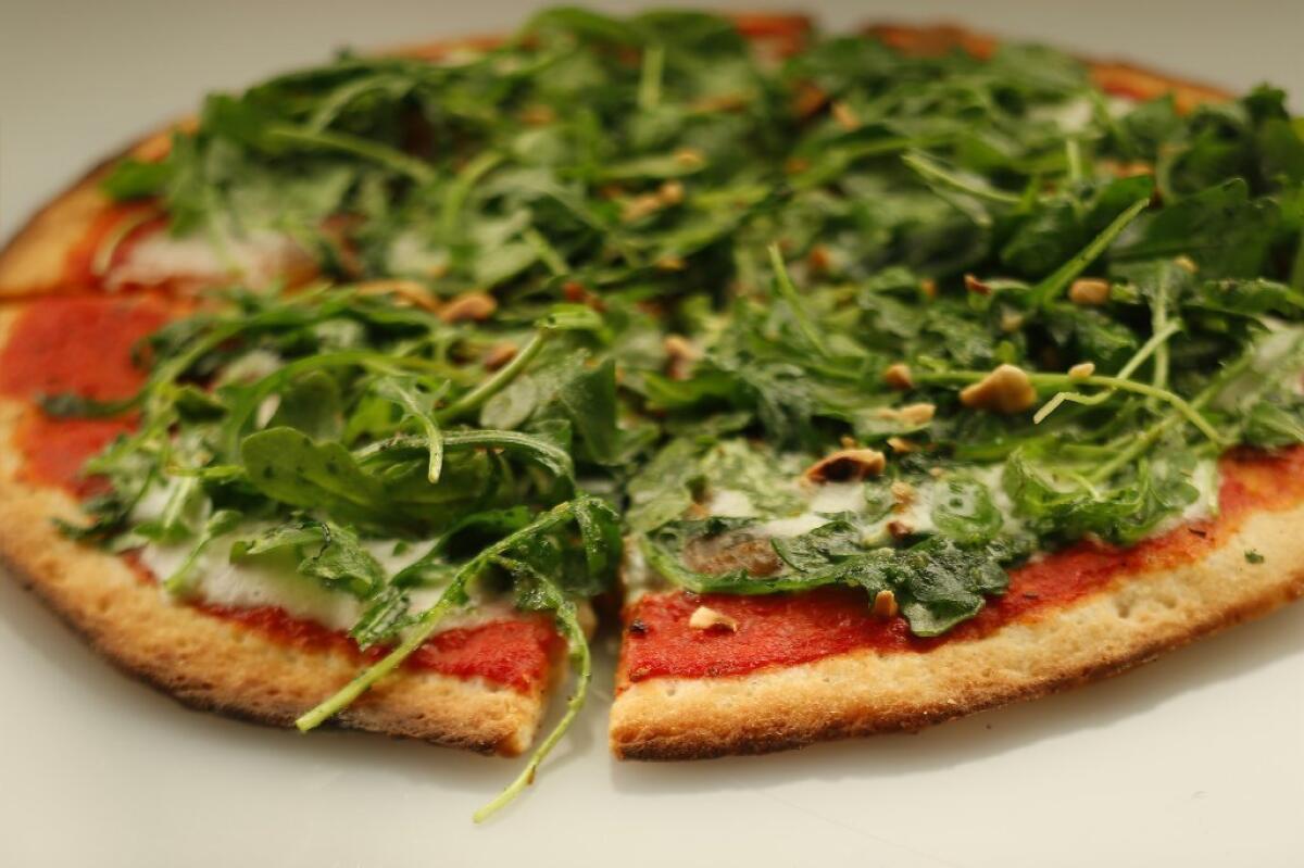 A gluten-free pizza with arugula and hazelnuts, from Pitfire Pizza in Los Angeles.