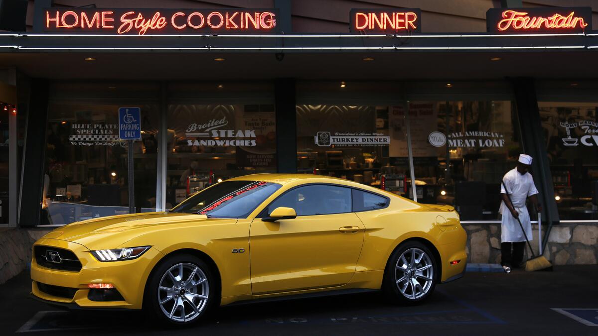 A new 2015 Ford Mustang in the parking lot of Mel's Drive-in in West Hollywood on Sept. 17. Ford brought a fleet of 50 early-production Mustangs to Southern California for 250 car critics to put the car through its paces in the local mountains and on the Pacific Coast Highway.
