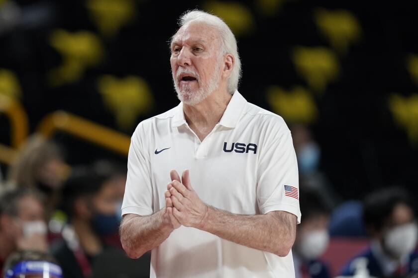 U.S. coach Gregg Popovich questions a call against his team during a game against France on July 25 at the Tokyo Olympics.