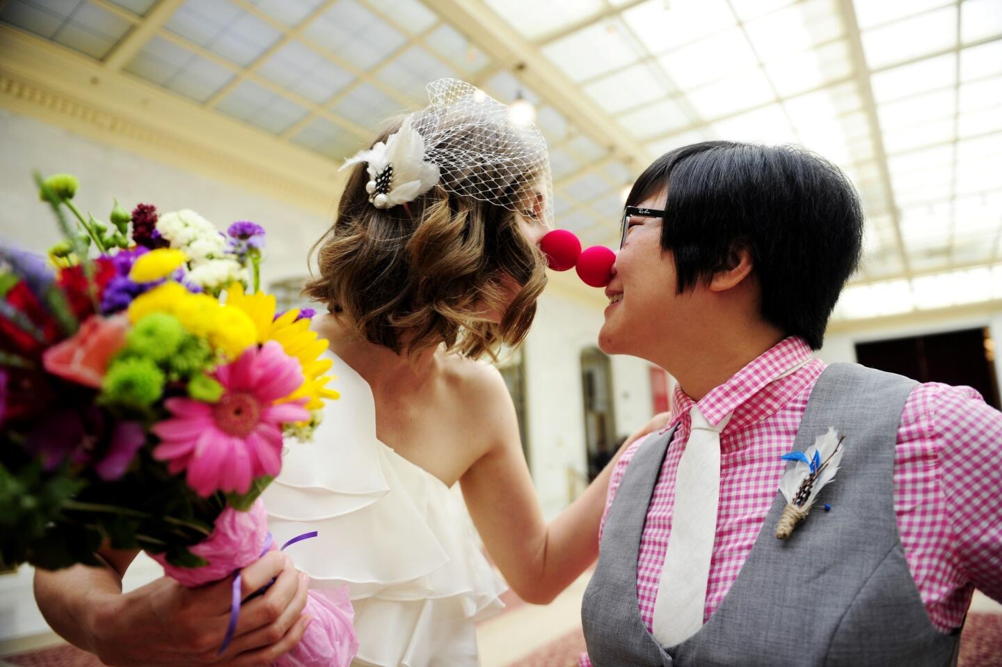 Ashlee and Ky Meyer-Choi touch noses after getting married in San Francisco City Hall on Saturday. "We've overcome a lot of struggles to be together, so to see all the support and love is something we haven't experienced," Ky said.