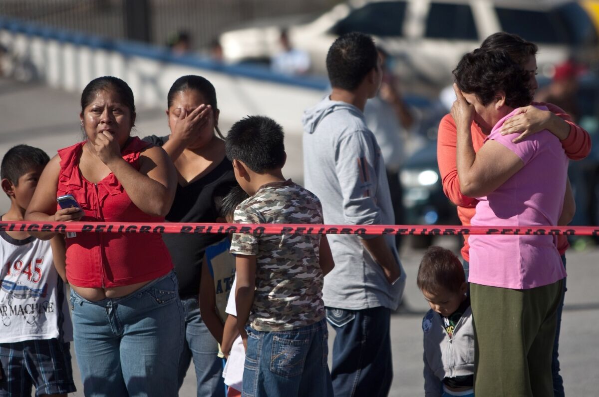 Relatives and friends of workers wait for news after an explosion at a candy factory in Ciudad Juarez, in northern Mexico.