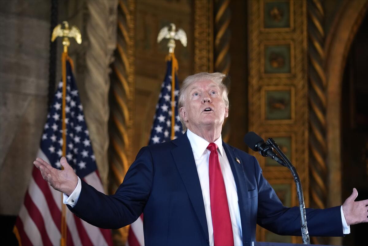 Former President Trump gestures and looks at the ceiling at Mar-a-Lago.