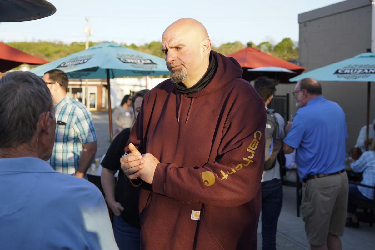 FILE - Pennsylvania Lt. Governor John Fetterman, greets supporters at a campaign stop May 10, 2022, in Greensburg, Pa. In his first media interview since suffering a stroke, Pennsylvania Democratic Senate candidate John Fetterman says he is "100% able to run fully and to win" his general election campaign against Republican Dr. Mehmet Oz in November. (AP Photo/Keith Srakocic, File)