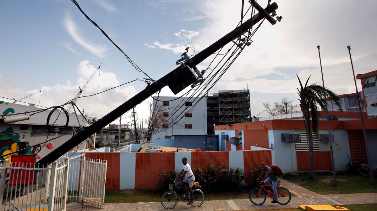 In downtown San Juan, Puerto Rico, electric lines lie in the road and block apartment complexes.