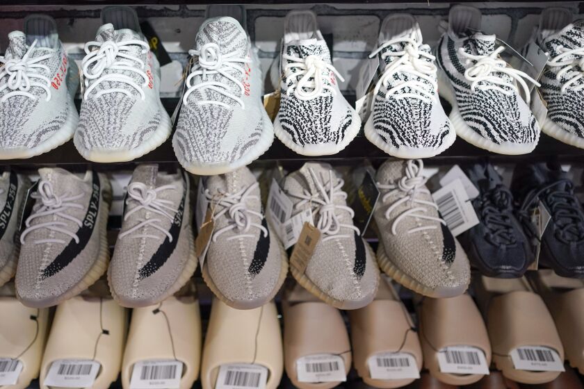 FILE - Yeezy shoes made by Adidas are displayed at Laced Up, a sneaker resale store, in Paramus, N.J., Tuesday, Oct. 25, 2022. Some of Adidas' remaining Yeezy shoes are back on sale, Wednesday, May 31, 2023, months after the German sportsware company cut ties with Ye, the rapper formerly known as Kanye West. (AP Photo/Seth Wenig)