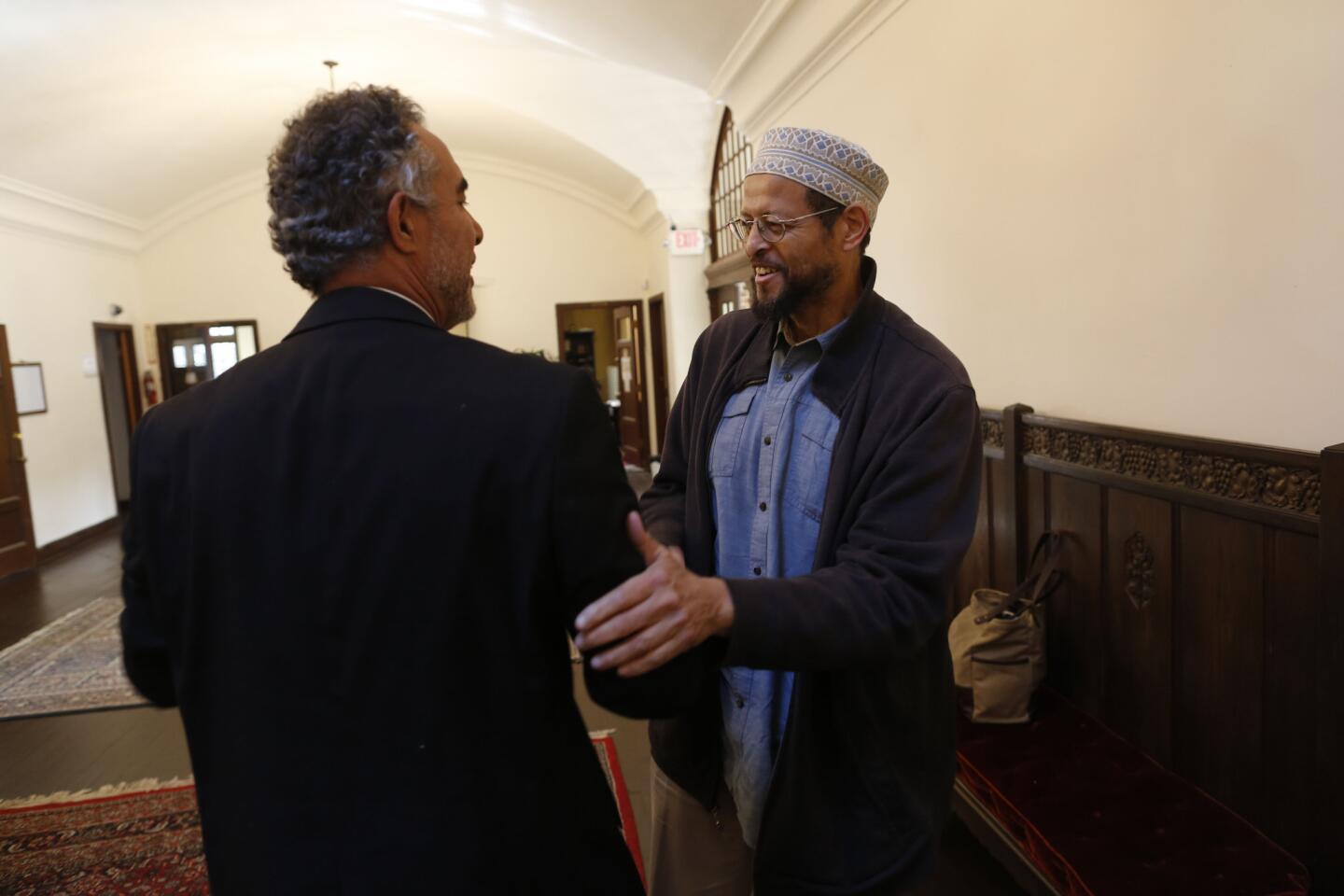 Imam Zaid Shakir, co-founder of Zaytuna College, the only Muslim liberal arts college in the U.S., greets visiting Imam Aziz Eddebbarh, from Las Vegas.