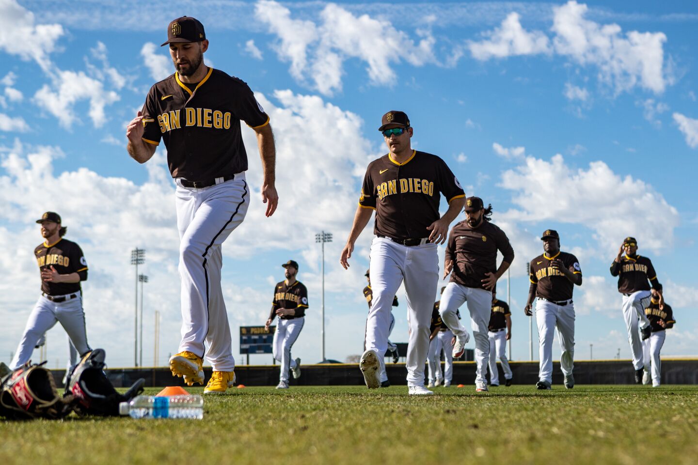 Padres starting pitcher Michael Wacha (52), center left, and pitchers stretch during a spring training practice at the Peoria Sports Complex on Sunday, Feb. 19, 2023 in Peoria, AZ.