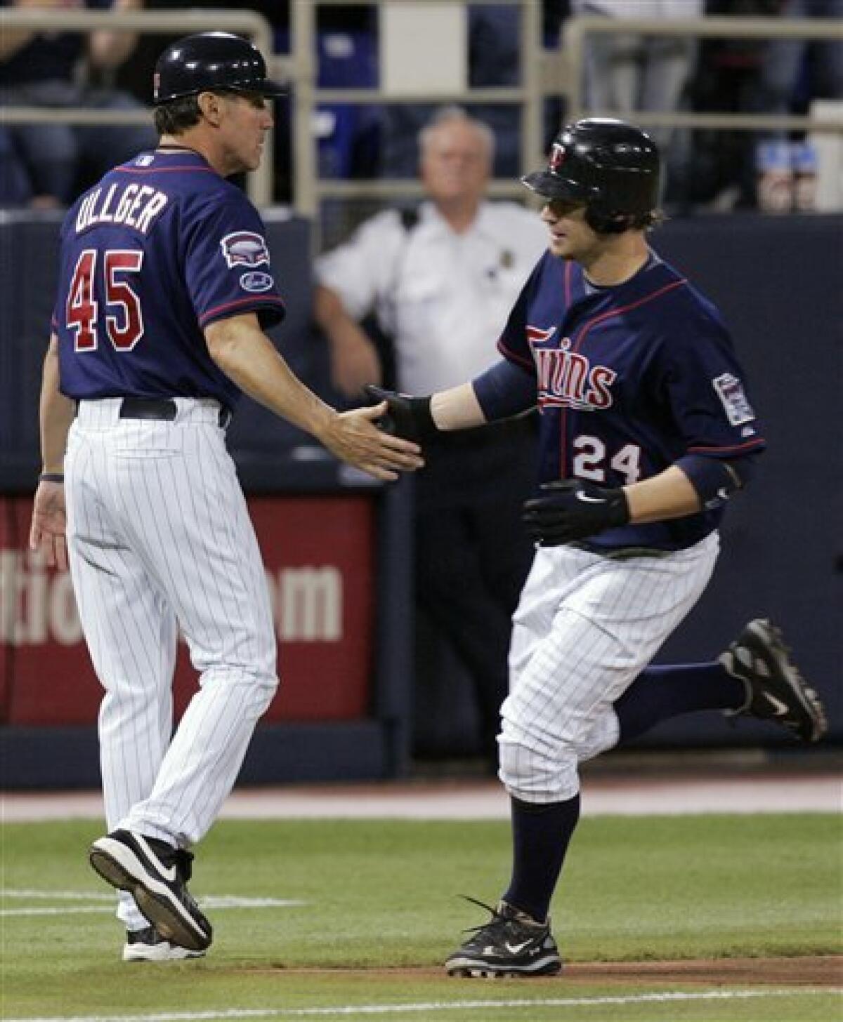 Joe Mauer doubles, catches in Twins finale
