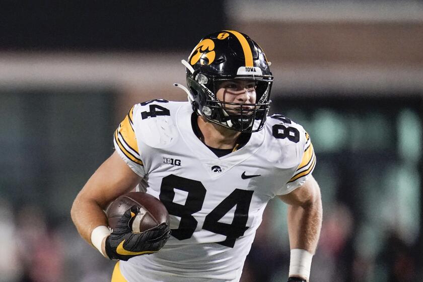 Iowa tight end Sam LaPorta runs with the ball after making a catch against Maryland during the first half of an NCAA college football game, Friday, Oct. 1, 2021, in College Park, Md. (AP Photo/Julio Cortez)