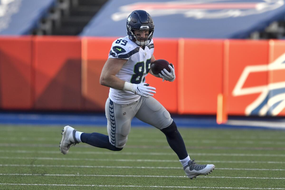 Seattle Seahawks tight end Will Dissly carries the ball against the Buffalo Bills.