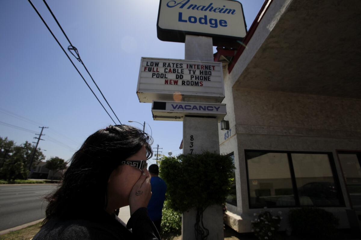 Jodi Estepp in April at an Anaheim motel where her daughter Jarrae Estepp, 21, had stayed before she was slain. Police think Franc Cano and Steven Gordon, both registered sex offenders, killed her and three other women.
