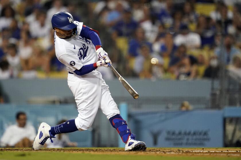 The Dodgers' Mookie Betts connects for a three-run home run during the fourth inning Sept. 3, 2022.