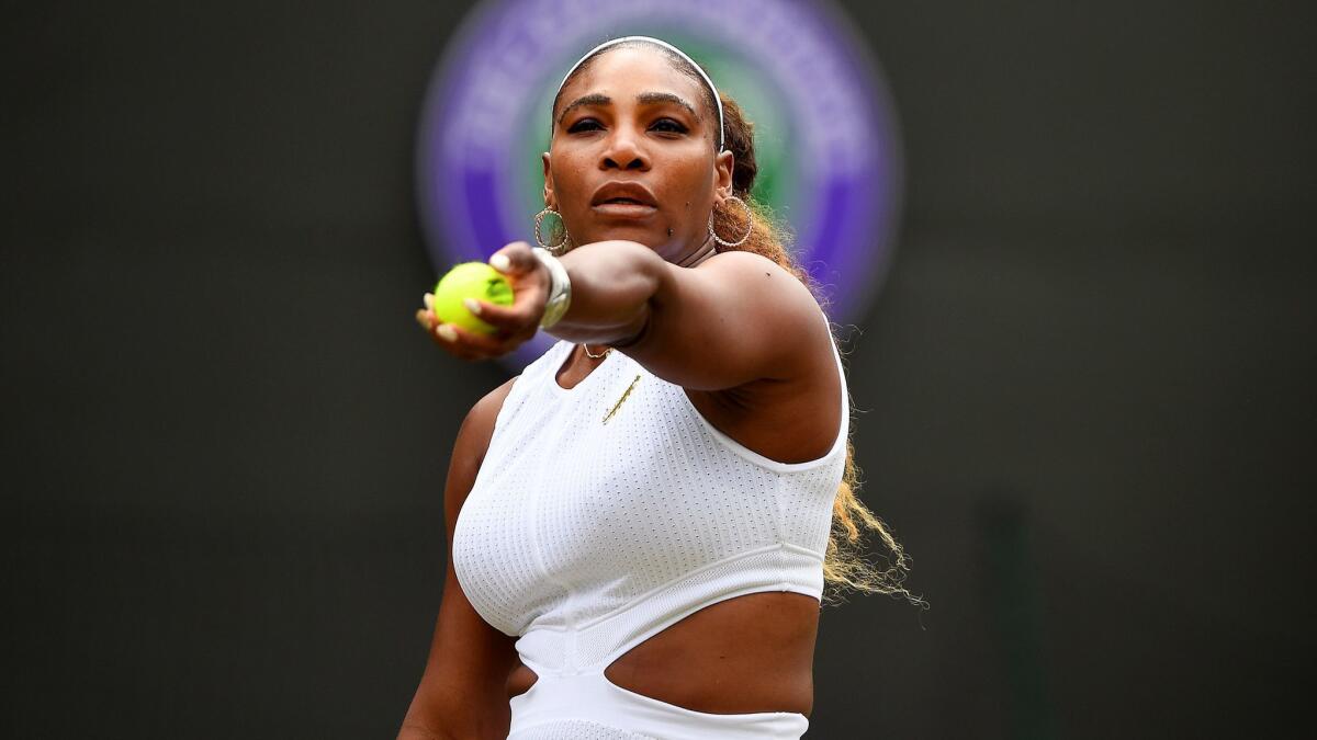 Serena Williams prepares to serve against Julia Goerges during the third round at Wimbledon.