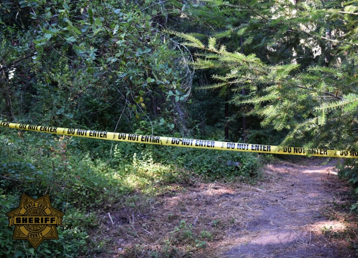 Yellow tape marks a crime scene in the Santa Cruz Mountains. 