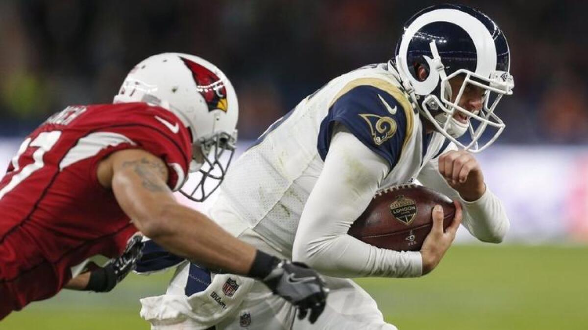 Rams quarterback Jared Goff runs the ball against the Arizona Cardinals at Twickenham Stadium in London.