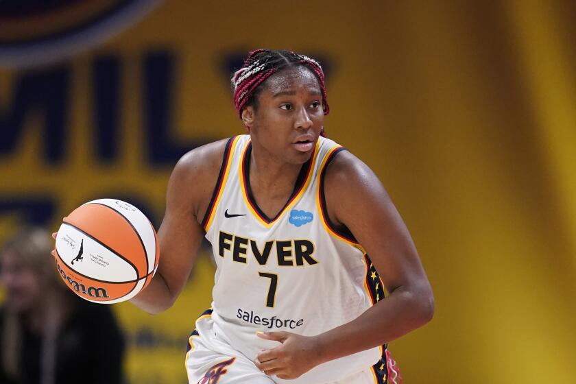 FILE - Indiana Fever's Aliyah Boston dribbles during the second half of a WNBA basketball game against the Connecticut Sun, Friday, Aug. 4, 2023, in Indianapolis. Aliyah Boston had an incredible first season and was honored by the league as the WNBA Rookie of the Year, Monday, Oct. 2, 2023. (AP Photo/Darron Cummings, File)
