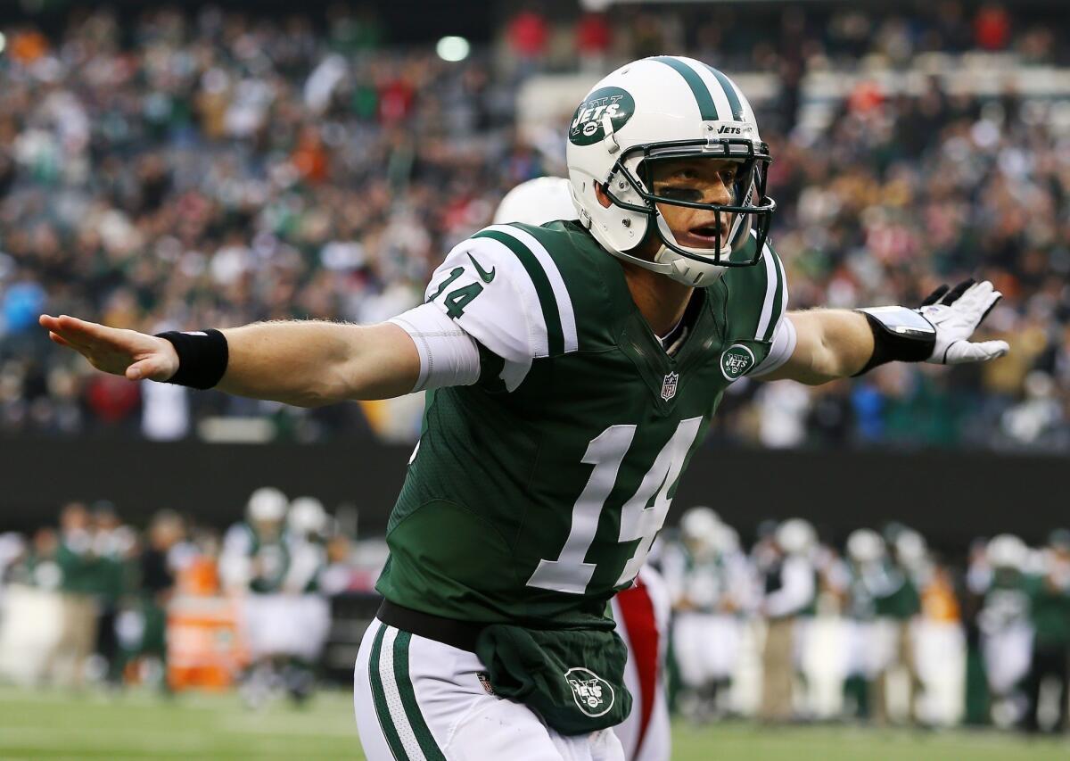 New York Jets quarterback Greg McElroy celebrates after throwing for his first NFL touchdown Sunday against the Arizona Cardinals.