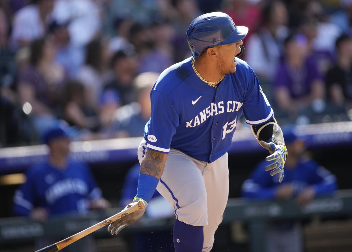 Kansas City Royals' Salvador Perez yells as he heads up the first-base line after connecting for a single to drive in two runs off Colorado Rockies relief pitcher Daniel Bard in the ninth inning of a baseball game, Sunday, May 15, 2022, in Denver. (AP Photo/David Zalubowski)