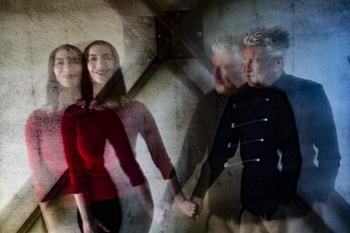 David Lynch holds hands with singer Chrystabell in a double exposure.