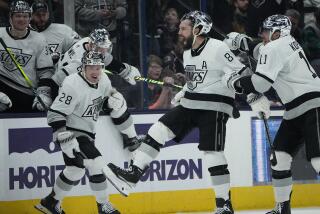 Los Angeles Kings' Drew Doughty (8) celebrates his game winning goal with teammates Jaret Anderson-Dolan (28) and Anze Kopitar (11) in overtime of an NHL hockey game against the Columbus Blue Jackets, Tuesday, Dec. 5, 2023, in Columbus, Ohio. (AP Photo/Sue Ogrocki)