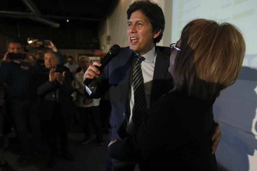 LOS ANGELES, CALIF. -MAR. 3, 2020. L.A. City Council candidate Kevin DeLeon gets a hug from labor leader Maria Elena Durazo at an election night party in Los Angeles on Tuesday night, Mar. 3, 2020. . (Luis Sinco/Los Angeles Times)