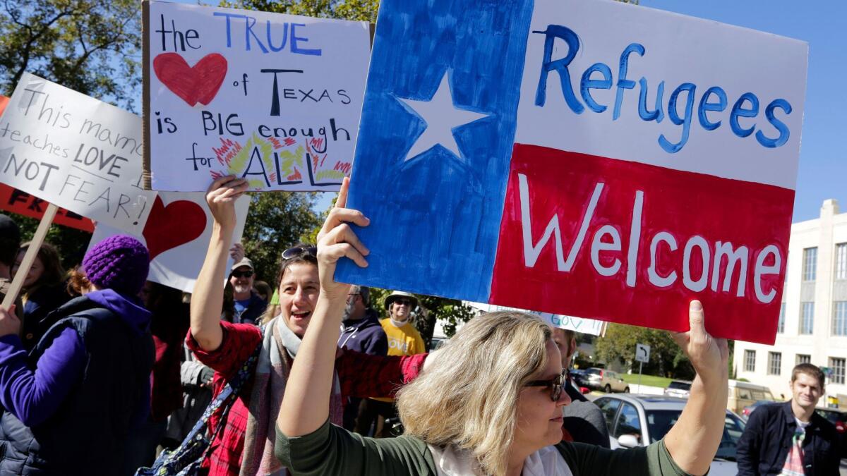 Supporters of the Syrian People Solidarity Group in Austin protest in November 2015 against Texas Gov. Greg Abbott's refusal to allow Syrian refugees into the state.