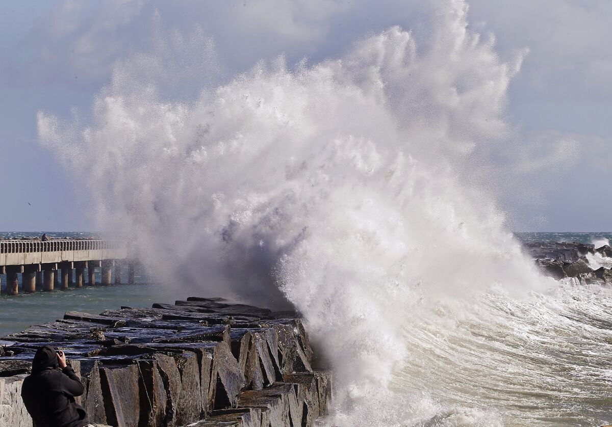 A wave crashes into the breakwater at Cabrillo Beach in San Pedro on Feb. 22.