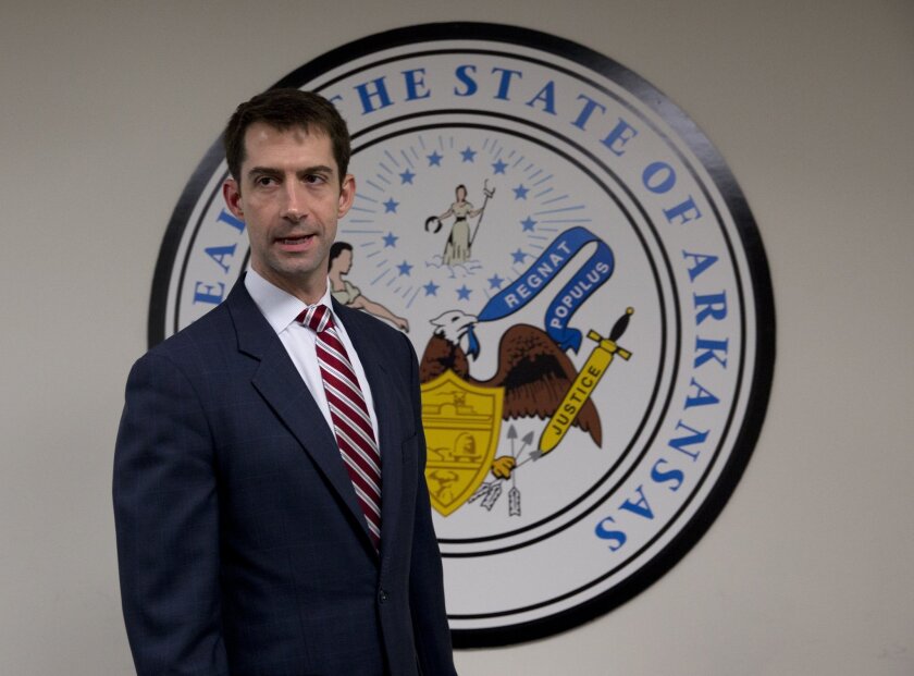 Sen. Tom Cotton, R-Ark. arrives to pose for photographers in his office on Capitol Hill in Washington, D.C., on March 11, 2015.