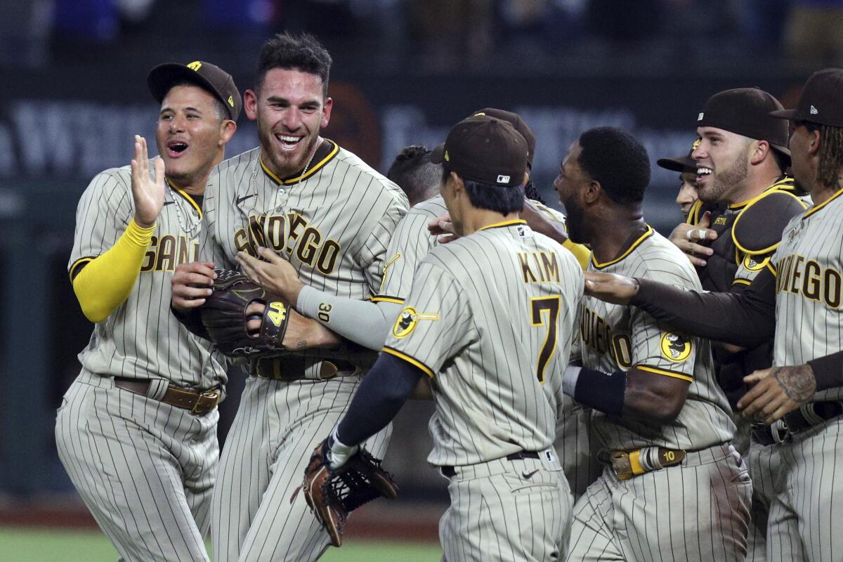 Padres pitcher Joe Musgrove celebrates with teammates after throwing no-hitter Friday against the Rangers
