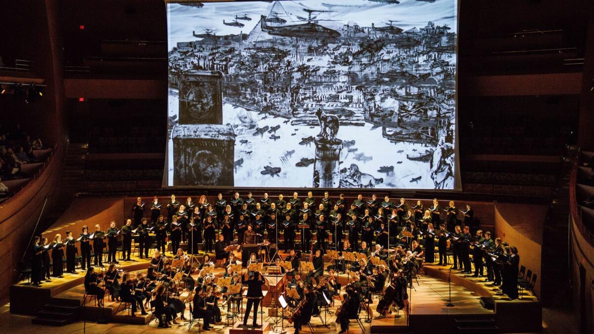 The Los Angeles Master Chorale performs "Israel in Egypt," a concert that included video and live drawing by artist Kevork Mourad at Walt Disney Concert Hall in Los Angeles.