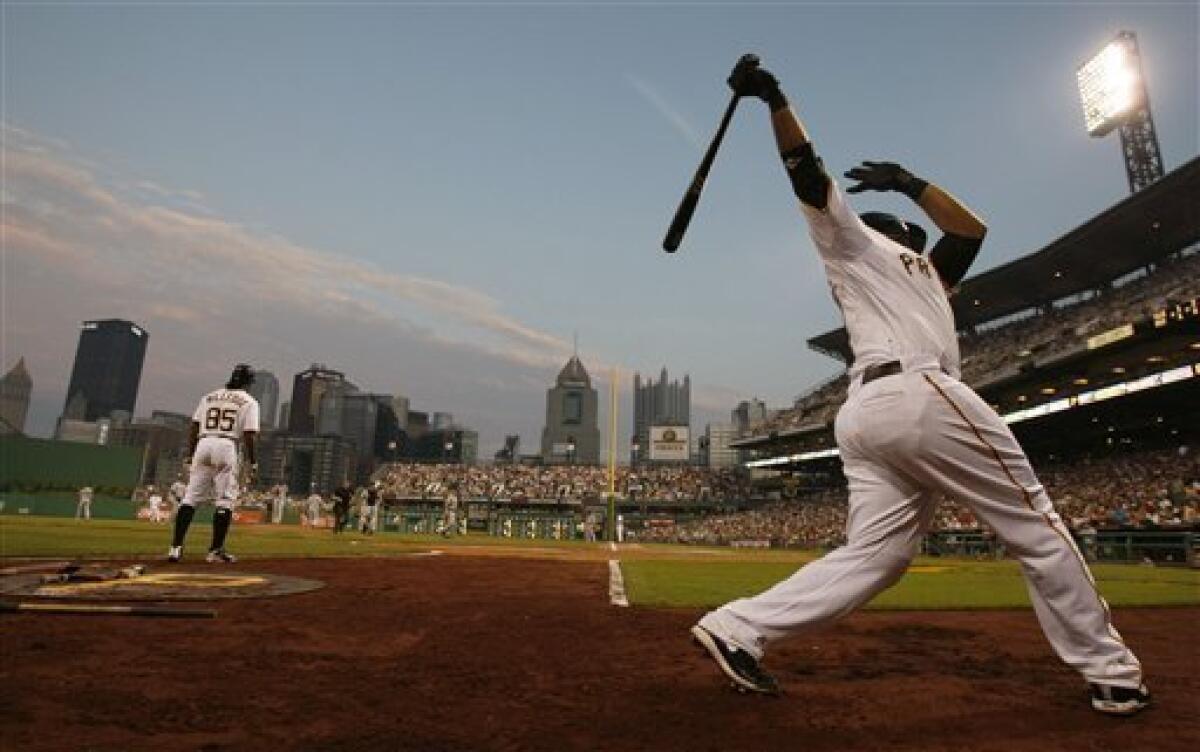 Pittsburgh Pirates Pedro Alvarez tosses his bat and walks to first