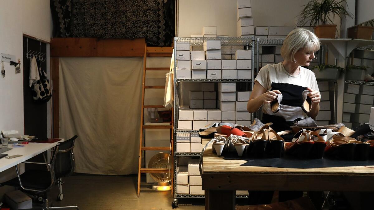 Jessica Taft Langdon sorts through shoes at her studio.