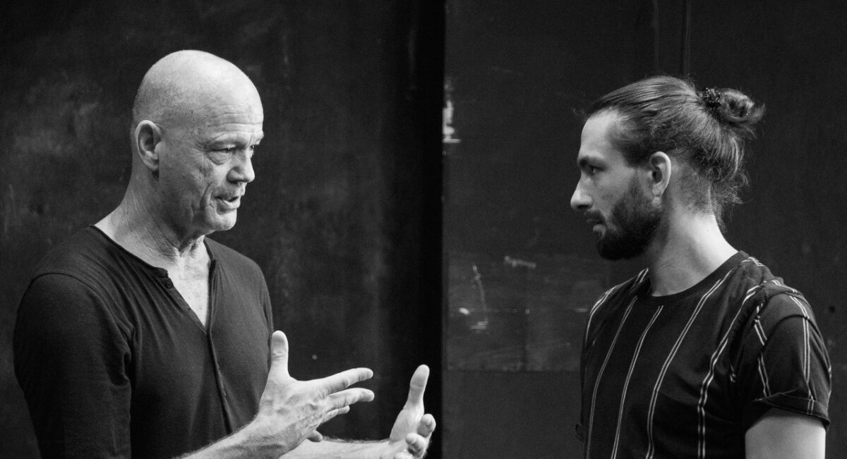 Choreographer Joe Alter discusses steps with dancer Piotr Stanek.