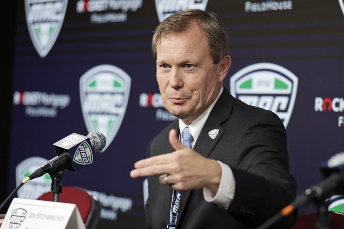 Mid-American Conference Commissioner Jon Steinbrecher speaks during a news conference.