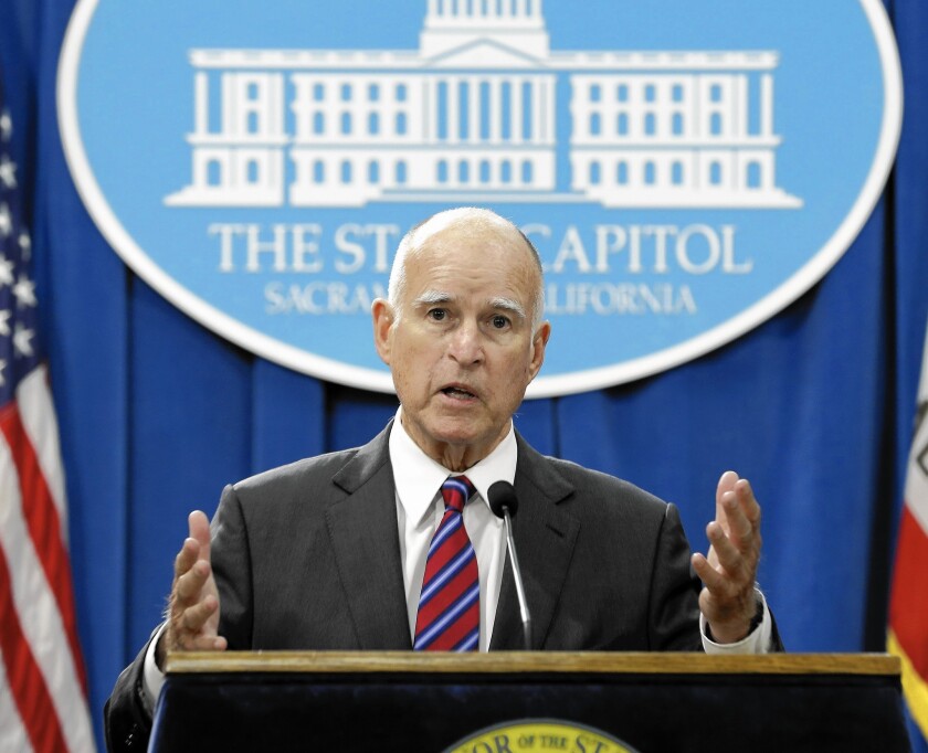 At a Sacramento news conference, Gov. Jerry Brown tells how he and state Senate leader Kevin de León (D-Los Angeles) were forced to abandon a key provision of their climate change package.
