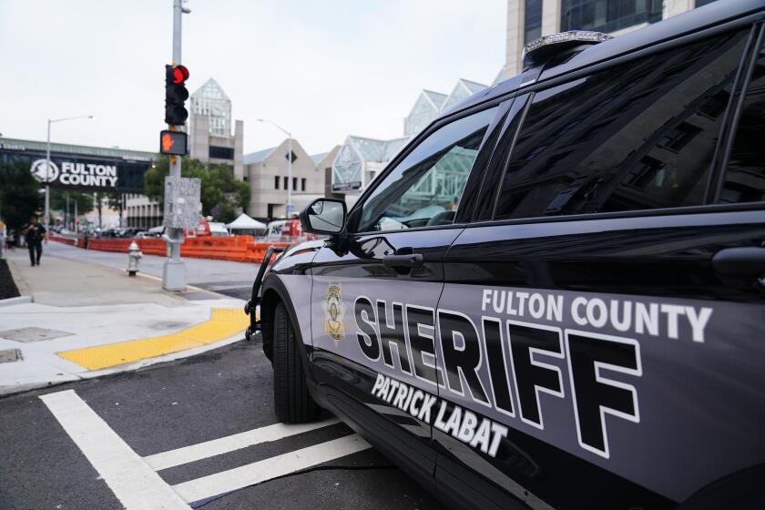 Barricades are seen near the Fulton County courthouse, Monday, Aug. 7, 2023, in Atlanta. The sheriff's office are implementing various security measures ahead of District Attorney Fani Willis possibly seeking an indictment in her investigation into whether former President Donald Trump and his allies illegally meddled in the 2020 election in Georgia. (AP Photo/Brynn Anderson)