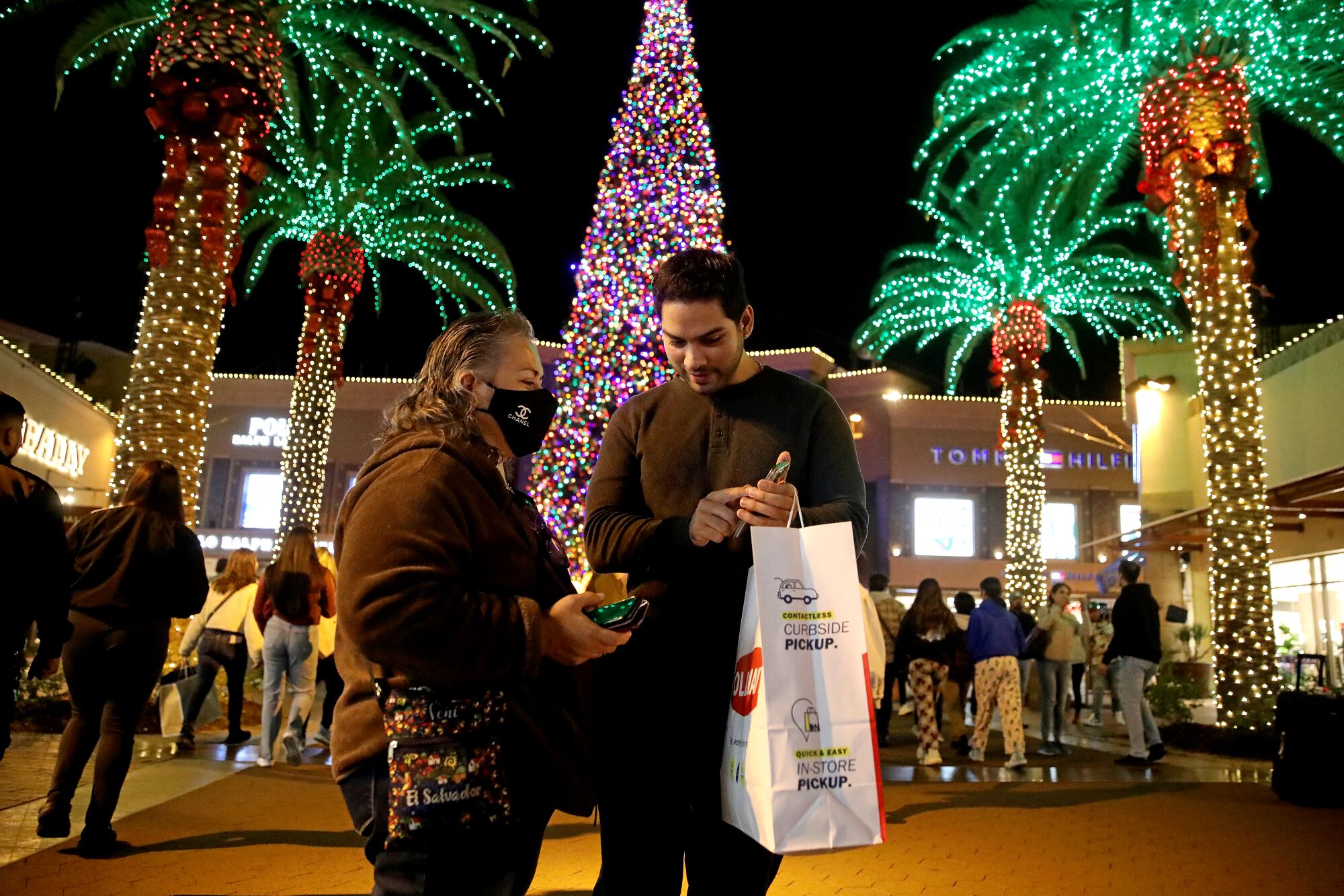 Shoppers enjoy exclusive Black Friday deals on Thanksgiving night at the Citadel Outlets in Commerce.