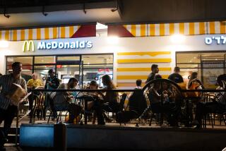 TEL AVIV, ISRAEL - JUNE 11: People dit at McDonald's outdoor seating after going out on a Saturday night along Rothschild Street on June 11, 2022 in Tel Aviv, Israel. On April 24th Israel removed all COVID-19 restrictions for both tourists and residents creating the opportunity for increased tourism and revenue as the summer begins. (Photo by Alexi Rosenfeld/Getty Images)