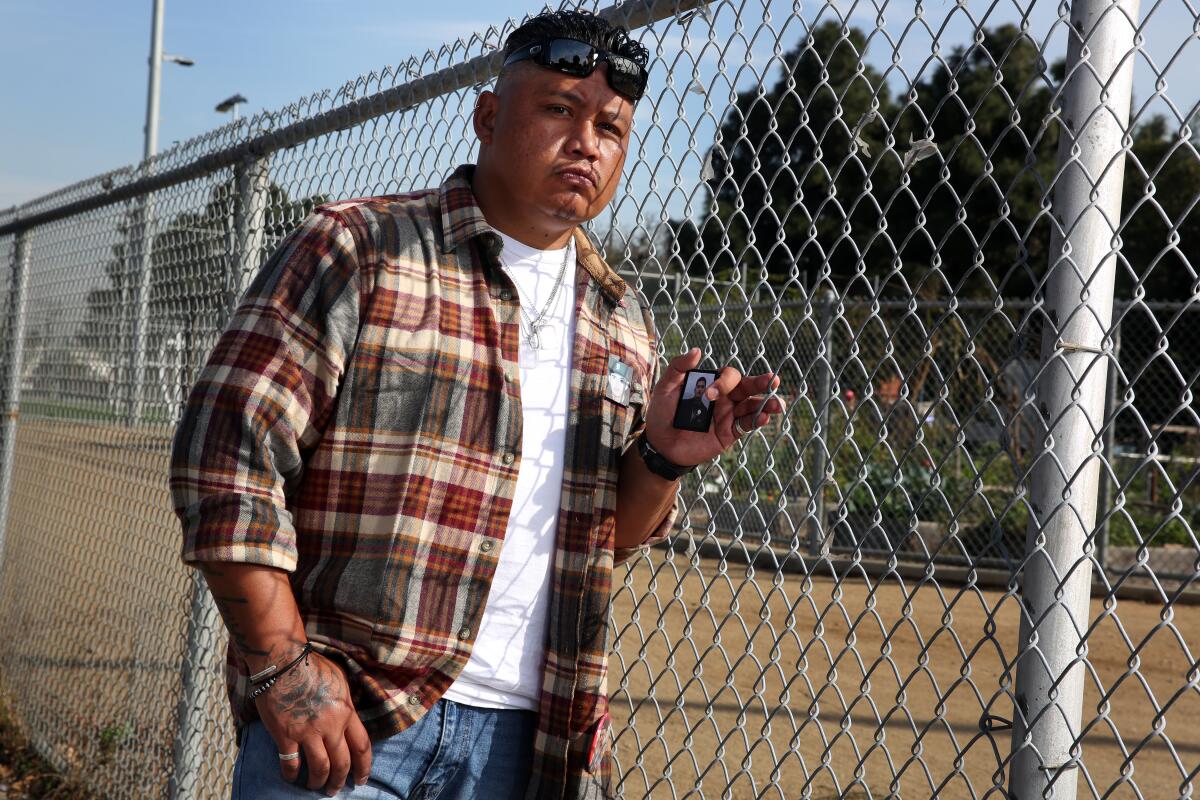 Roque Santos stands near where his son, Jarrod Santos, was killed with his cousin Jesse Meza in Wilmington. 