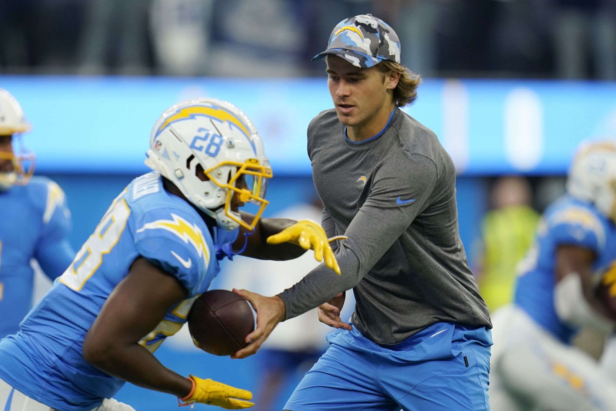 Chargers quarterback Justin Herbert doesn't like running back Isaiah Spiller during hot periods.