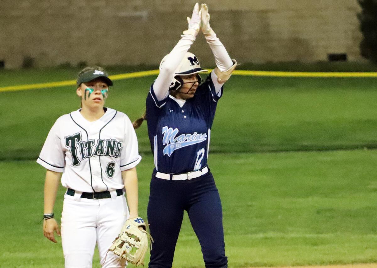 Marina's Rylee Gonzalez (12) celebrates after hitting a double against Poway in the Michelle Carew Classic.