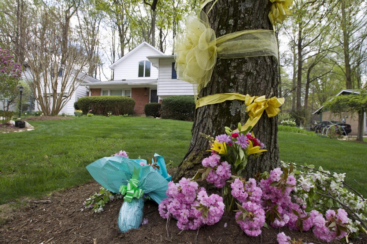 Flowers and ribbons adorn a tree in Rockville, Md., on Thursday, outside the home of the family of Warren Weinstein, who was mistakenly killed in a U.S. drone strike this year.