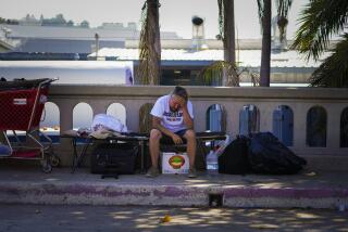 San Diego, CA - June 29: On Wednesday, June 29, 2022 in San Diego, CA., Eric Barbar, 36 sat on his cot where he has been sleeping and living since his van was impounded for vehicle violations. Barbar, was among the group living out of their cars, RVs and tents on Anna Avenue when they issued vehicle violation warning notices and informed by SDPD that a work crew would be coming through to gather and discard items left behind. (Nelvin C. Cepeda / The San Diego Union-Tribune)