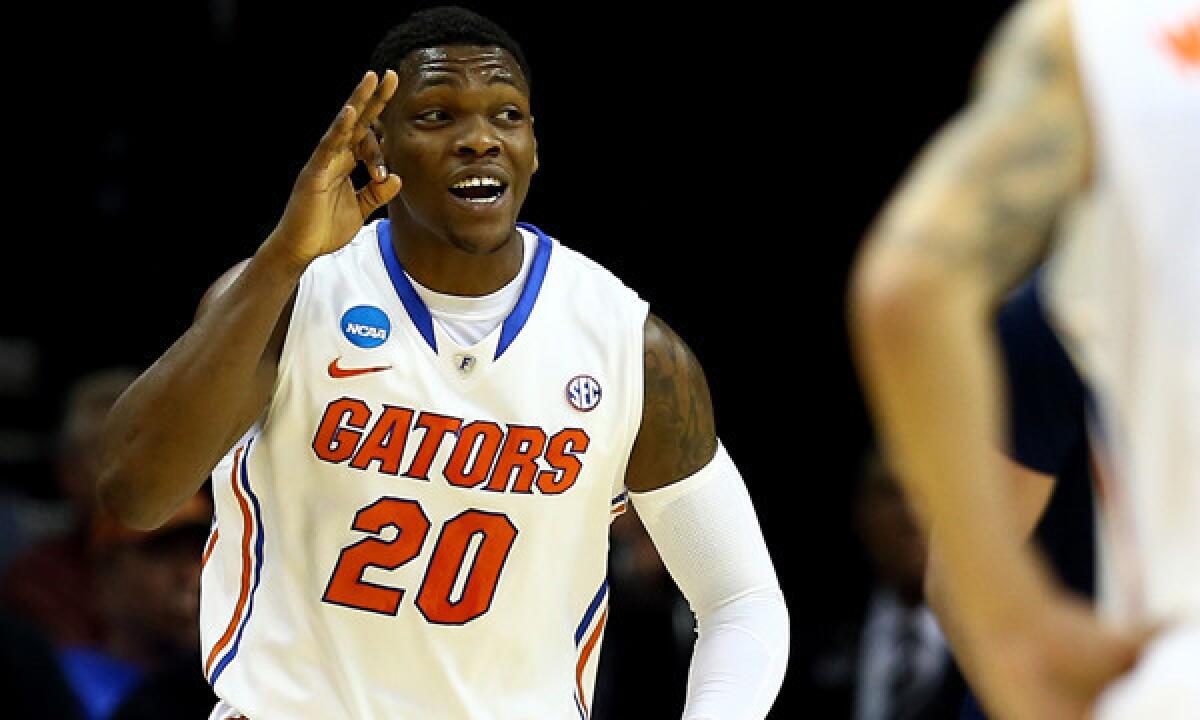 Florida's Michael Frazier II celebrates after hitting a shot in an NCAA tournament win over UCLA. Frazier's ability to be a constant scoring threat from the perimeter isn't the only characteristic that sets him apart from many other college basketball players.