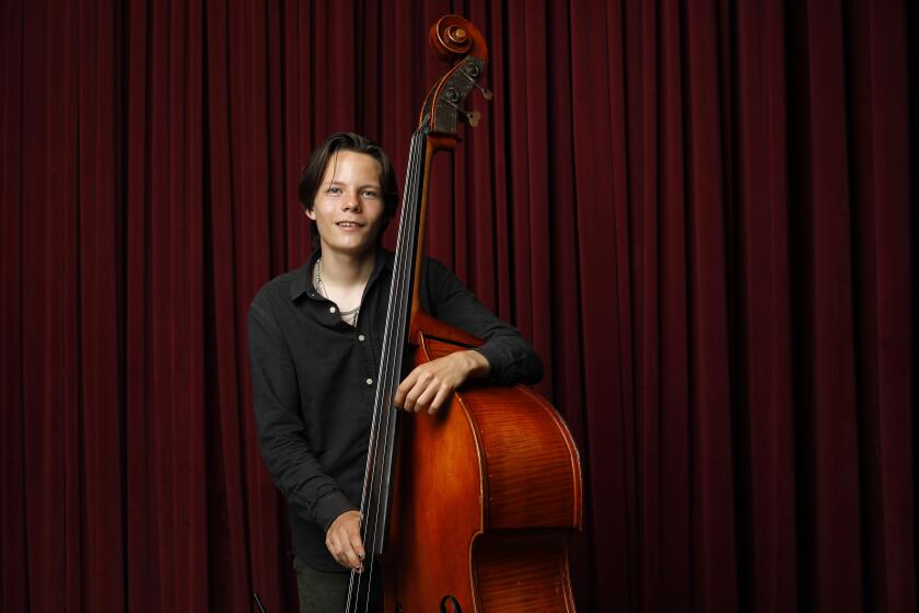 SAN DIEGO, CA - JUNE 30: John Murray, 17, is a jazz bass wiz who has won national awards, shown here in Balboa Park on Wednesday, June 30, 2021 (K.C. Alfred / The San Diego Union-Tribune)