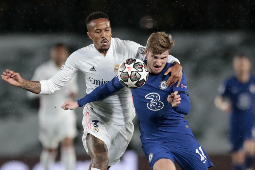 Chelsea's Timo Werner vies for the ball with Real Madrid's Eder Militao, left, during the Champions League semifinal first leg soccer match between Real Madrid and Chelsea at the Alfredo di Stefano stadium in Madrid, Spain, Tuesday, April 27, 2021. (AP Photo/Bernat Armangue)