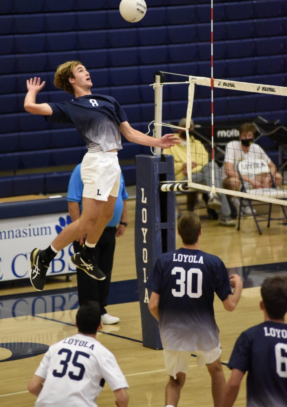 Dillon Klein of Loyola leaps for a shot against Mira Costa .