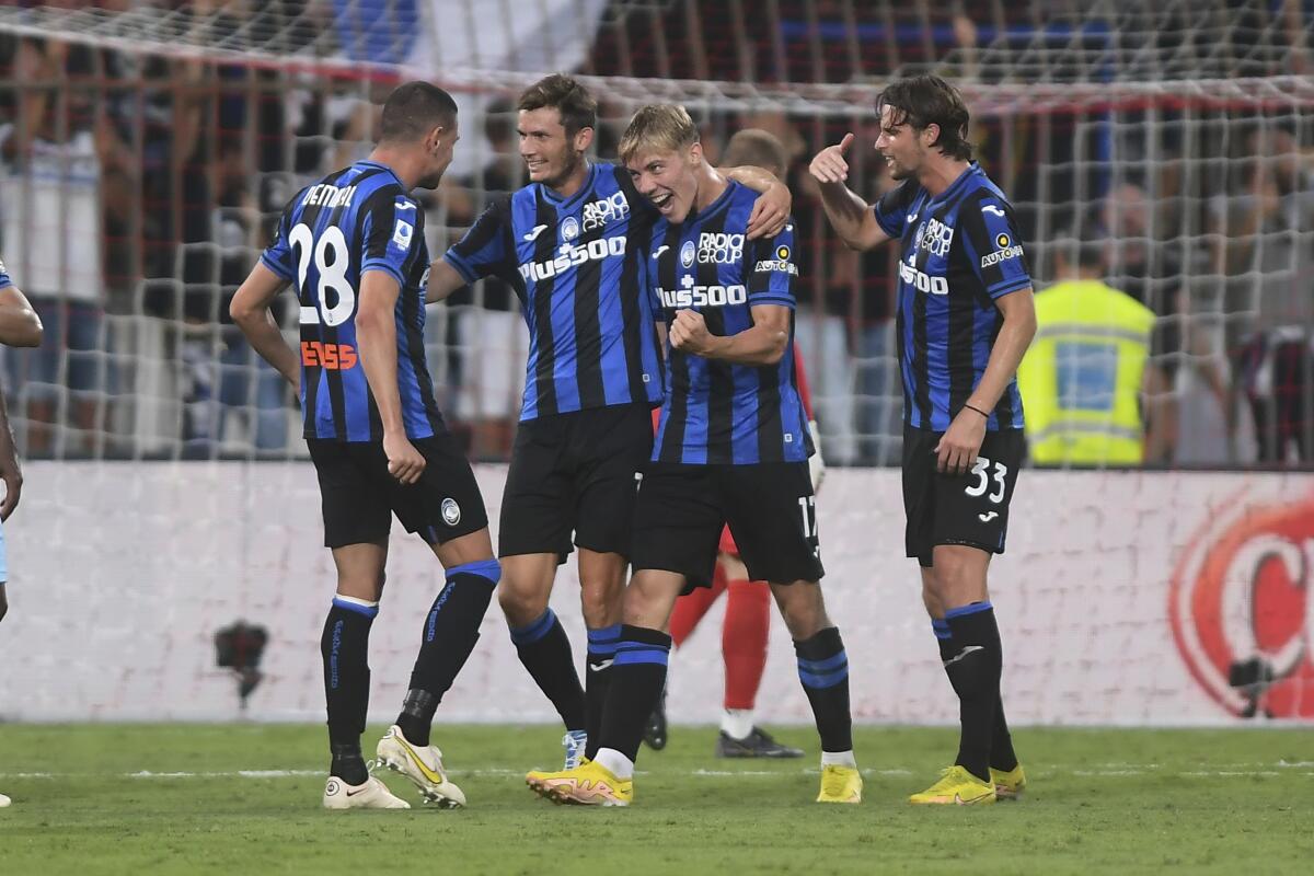 Atalanta's Rasmus Hojlund celebrates after scoring to 1-0 during the Serie A soccer match between Monza and Atalanta, in Monza, Italy, Monday, Sept. 5, 2022. (Claudio GrassiLaPresse via AP)