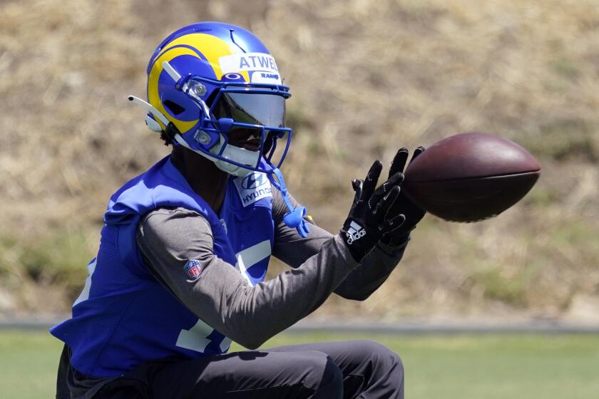 Los Angeles Rams wide receiver Tutu Atwell (15) makes a catch at the NFL football team's practice facility Thursday, May 26, 2022, in Thousand Oaks, Calif. (AP Photo/Marcio Jose Sanchez)
